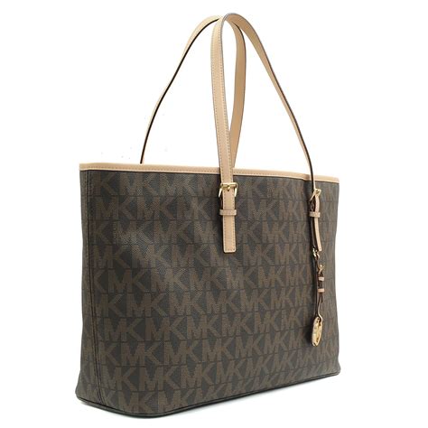 michael kors jet set travel md ew tote black gold|Michael Kors airplane print.